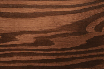 Texture of wooden surface after applying walnut wood stain as background, top view