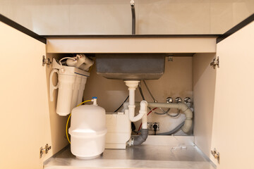 Discovering hidden potential beneath the sink during an apartment interior design renovation