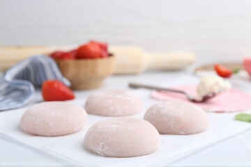 Tasty homemade mochi on white table, closeup