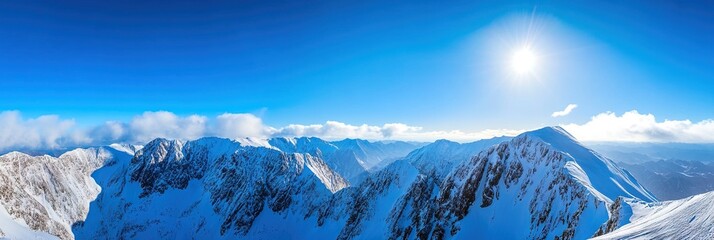 Changbai Mountain, with the snow-covered peaks contrasting with the clear blue sky. 