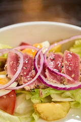 A Fresh and Colorful Salad with a Variety of Fresh Vegetables and Sliced Onions Included