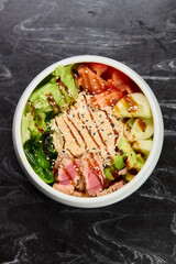 A Fresh and Colorful Salad Bowl that features Grilled Chicken and a Variety of Vegetables