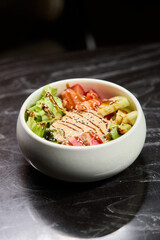 A Fresh and Colorful Salad Bowl that features Grilled Chicken and a Variety of Vegetables