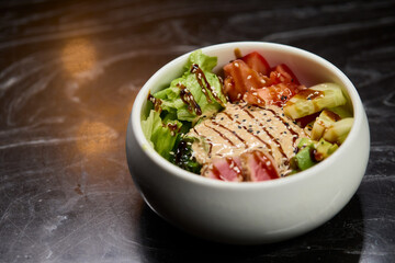 A Fresh and Colorful Salad Bowl that features Grilled Chicken and a Variety of Vegetables