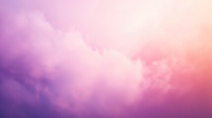 Fototapeta premium Soft, dreamy clouds in a pastel pink and purple sky.