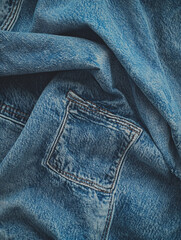 Naklejka premium Jeans made from recycled materials with a distressed wash on a denim