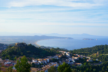 Obraz premium View over Begur with its hilltop castle over the beautiful countryside of Catalonia and the Mediterranean Sea to the Pyrenees, Illes Medes, l'Estartit, Catalonia, Costa Brava, Spain