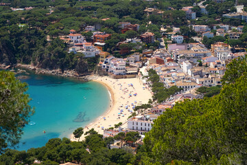 view from the hills to the beautiful bay with beach and promenade of the village Llafranc, Costa...
