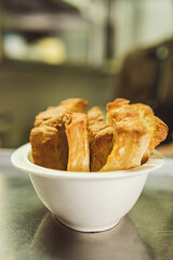 A bowl filled with warm bread rolls, ideal for breakfast spreads. Great for bakery ads, menus, or food blogs promoting fresh-baked goods