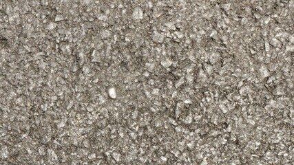 Black asphalt road background, close up of asphalt road texture with rough textured rocks