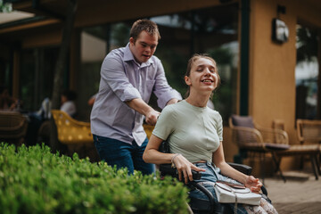 A boy with Down syndrome happily pushes a smiling girl in a wheelchair outside. The image captures friendship, inclusivity, and joy in an outdoor setting.