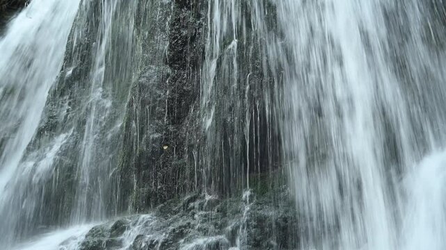 Closeup of a waterfall flowing over mossy stones, Josefsthaler Wasserf&auml;lle