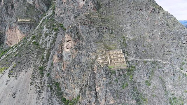 Drone flight towards Pinkuylluna ruins in Ollantaytambo, Peru