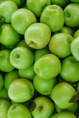 green apples background in a close-up display at a market