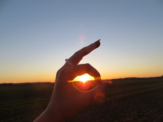 hand holding a sunset