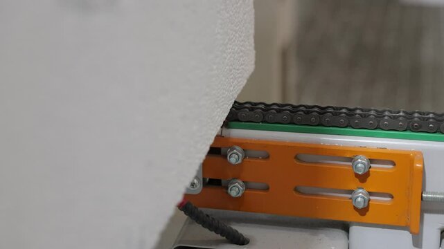 Industrial footage of a laser cutting foam at a factory. The precision laser slices through the material smoothly, demonstrating efficient manufacturing processes  production technology in action 