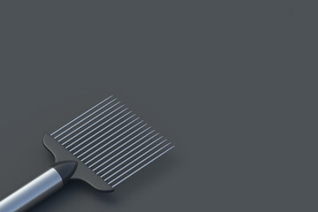 Metallic onion holder on black background. Device for vegetables slicing. Kitchen accessories. Copy space. 3d render