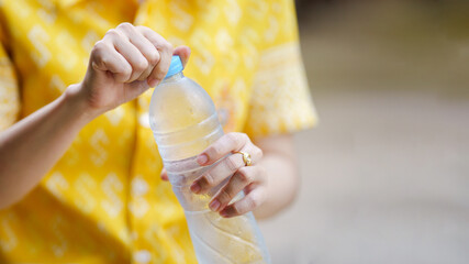 Opening water bottle with refreshing drink inside brings joy