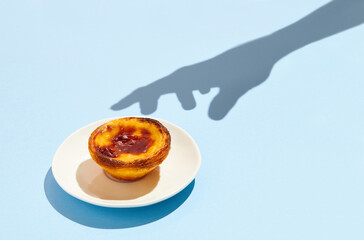 Traditional Portuguese egg tart dessert Pasteis Pastel de nata or Pastels de Belem on the plate...