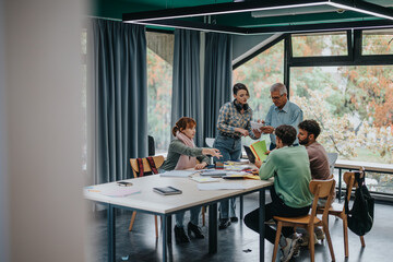 A group of university students working on a collaborative project with their senior professor offering guidance and support. The image captures a vibrant learning environment.