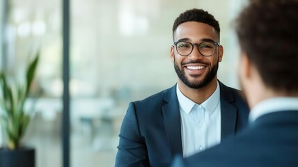 Fototapeta premium HR manager interviewing a candidate in a modern office setting, both smiling and engaged job interview, professional conversation, HR