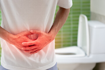 Constipation and diarrhea in bathroom. Hurt man touch belly  stomach ache painful. colon...