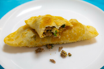 Traditional rustic Brazilian pastry, fried and stuffed with ground beef