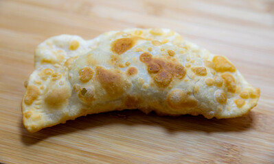 Traditional rustic Brazilian pastry, fried and stuffed with ground beef