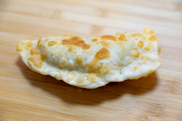 Traditional rustic Brazilian pastry, fried and stuffed with ground beef