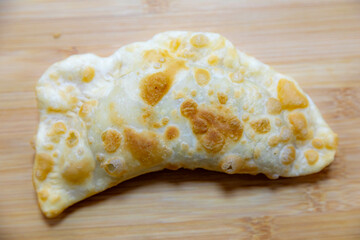Traditional rustic Brazilian pastry, fried and stuffed with ground beef