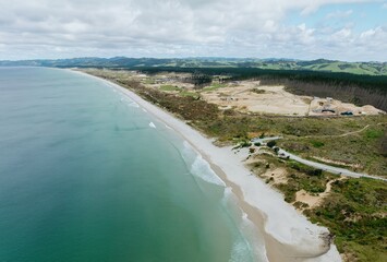 Forestry Beach, a calm sandy beach at Te Arai, Auckland, New Zealand.