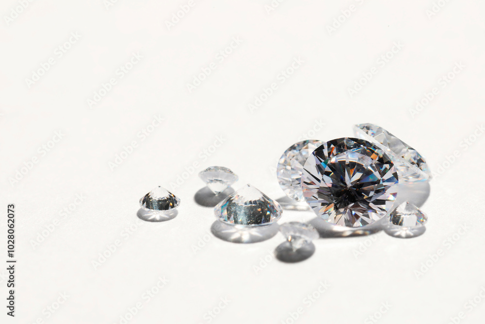 Poster Many beautiful shiny diamonds on white background, closeup. Space for text