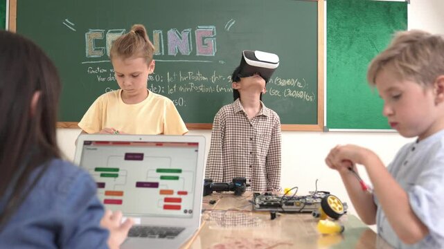 Energetic child wearing Vr headset while enter virtual world at classroom. Student programing system while generated AI to code engineering prompt software while boy fixing electronic board. Pedagogy.