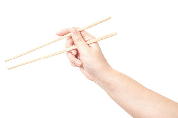 Female hand holding a wood chopstick isolated on white background.