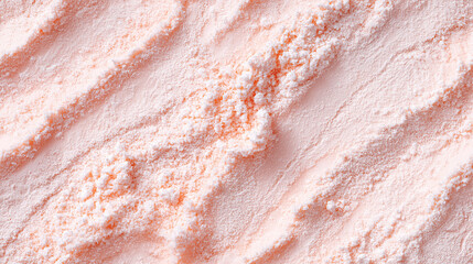 a close-up, top-down view of dried guava powder, showcasing a soft pink color with a smooth, powdery texture