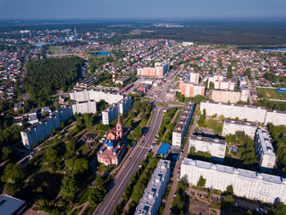 Fototapeta premium Aerial view of cityscape of Russian city of Orekhovo-Zuyevo overlooking blue domes of Cathedral of Nativity of Blessed Virgin