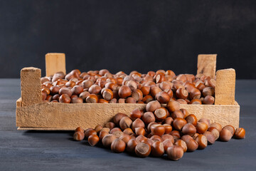 Pile of hazelnuts in a wooden crate