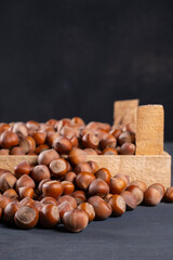 Pile of hazelnuts in a wooden crate
