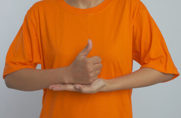 Giving a thumbs up with the other hand open and flat. Sign language