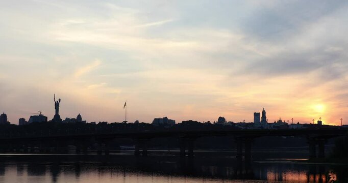 Beautiful view of the Mother Ukraine monument Paton Bridge on the Dnipro river in Kyiv, Ukraine