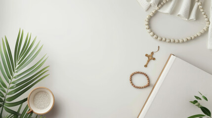 Minimalist christian flatlay with cross, beads, bible, and palm leaves for religious reflection