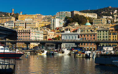 Obraz premium View of Old Port on background with cityscape of Genoa in sunny day