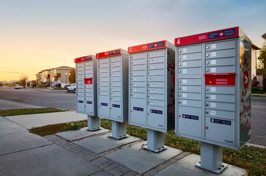 Canada Post mailboxes in a residential neighborhood. A neighborhood community scene featuring Canada Post mailboxes. Perfect for showcasing urban infrastructure, local services, and community settings