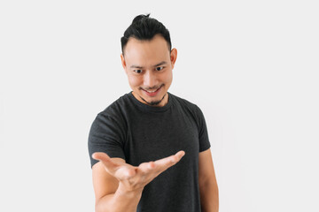 Happy Asian freelance man bun hair in black with thing in hand on white.