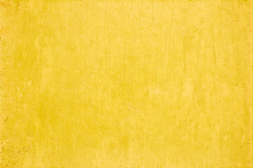 Yellow concrete stone texture for background in summer wallpaper. Cement and sand wall of tone...