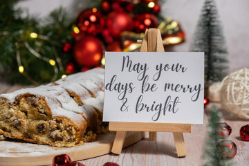 Paper note with text MAY YOUR DAYS BE MERRY AND BRIGHT congratulations. Homemade Christmas...