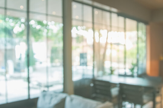 Fototapeta Abstract blur interior coffee shop or cafe for background. Blur restaurant interior banner. Hospital and clinic blurry with bokeh. Blurred windows green on garden outdoor and view of light living room