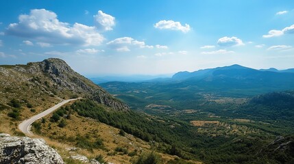 Majestic Mountain Landscape with Winding Road, Aerial Vista of Peaks and Pathways, Scenic Mountain Summit.