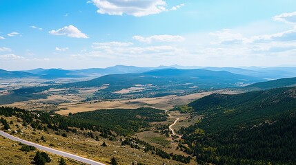 Majestic Mountain Landscape with Winding Road, Aerial Vista of Peaks and Pathways, Scenic Mountain Summit.