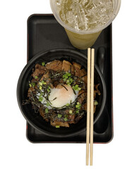 Japanese food, charcoal-grilled pork on rice, served in a bowl, chopsticks, iced green tea, placed on a Japanese-style square tray, die-cut image